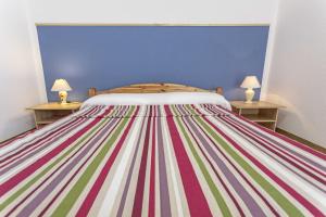 Postel nebo postele na pokoji v ubytování Appartamento Erica