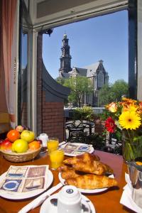 a table topped with plates of food on a table at Nadia Hotel in Amsterdam +19 photos