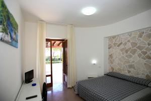 Cama o camas de una habitación en Hotel Parco Carabella