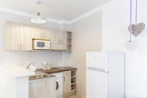 Kuchyň nebo kuchyňský kout v ubytování Apartamentos Lago