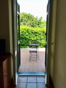 an open door to a patio with a table at Relais San Rocco in Sestri Levante
