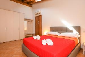 A bed or beds in a room at Residence Corte Ferrari -Ciao Vacanze-
