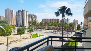 a balcony with a view of a city with tall buildings at ROMA XII - Apartamento Familiar in Playa de Gandia