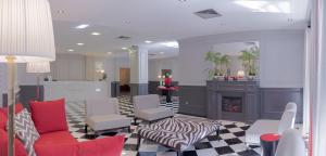 Uma área de estar em Your Hotel & Spa Alcobaça