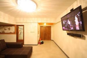 TV a/nebo společenská místnost v ubytování O.U.M. Hotel - โรงแรมโอยูเอ็ม
