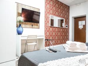 Postel nebo postele na pokoji v ubytování Magic Door Rome