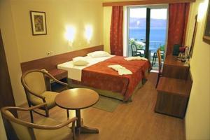 Postel nebo postele na pokoji v ubytování Hotel Kiani Akti