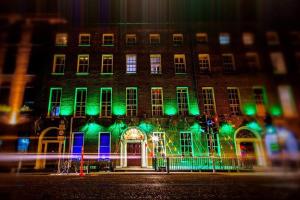 a building with green and green lights in front of it at Jackson Court Hotel in Dublin
