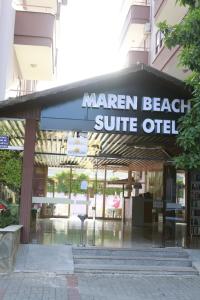 een bord voor een Maran Beach Surf Office bij Maren Beach Apart Hotel in Alanya
