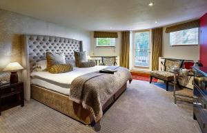 a bedroom with a large bed in a room at Dorian House Boutique B&B in Bath