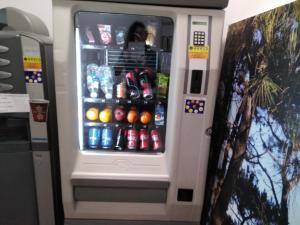 a vending machine filled with lots of soda at Alfonso XII in Redondela