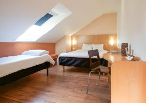 Ein Bett oder Betten in einem Zimmer der Unterkunft ibis Brussels Waterloo