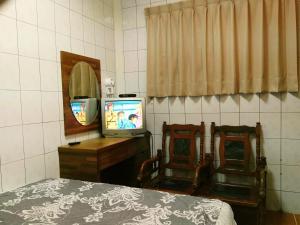 Letto o letti in una camera di Qun Feng Hotel