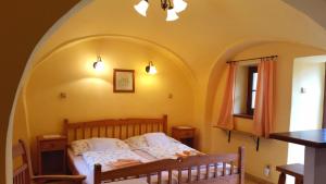 Postel nebo postele na pokoji v ubytování Penzion Merlin + 37 fotografií