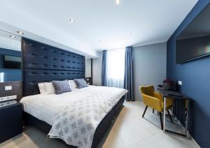 Postel nebo postele na pokoji v ubytování Hotel Tommasi