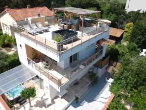 an aerial view of a house with a swimming pool at Villa L'Amiraute in Agde