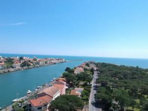 an aerial view of a town next to the water at Villa L'Amiraute in Agde