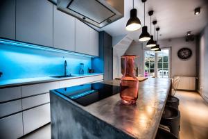 a vase sitting on top of a counter in a kitchen at The Grey House in Honfleur +35 photos