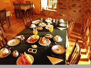 Restoran või mõni muu söögikoht majutusasutuses Muiño das Cañotas