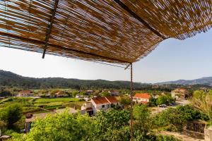 a view of a village from a straw roof at Old Small Stone House in Korčula