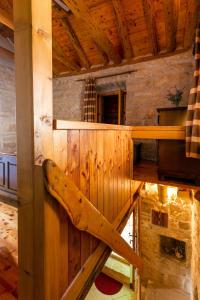 a sauna in a log cabin with a wooden wall at Old Small Stone House in Korčula