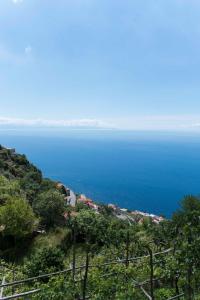 a view of the ocean from a hill at Residence Gioia in Furore