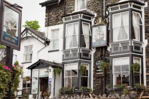 a building with black and white windows at The Royal Oak Inn in Bowness-on-Windermere