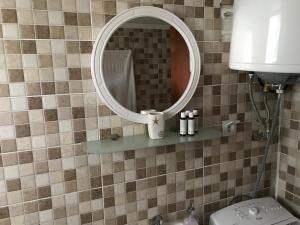 a bathroom with a mirror and a sink and a toilet at Anni House in Stavros in Stavros +42 photos