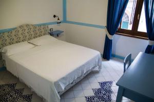 Postel nebo postele na pokoji v ubytování Hotel Del Sole Al Plebiscito