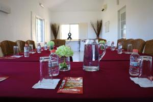 a long table with bottles of water on it at Zar Los Mochis in Los Mochis