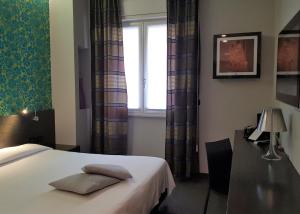 Posteľ alebo postele v izbe v ubytovaní MA Hotel