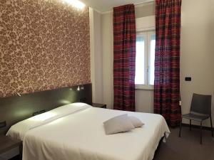 Posteľ alebo postele v izbe v ubytovaní MA Hotel
