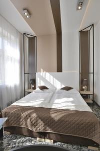 מיטה או מיטות בחדר ב-Máchova