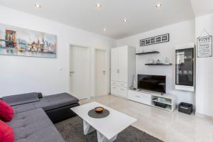 Kuchyň nebo kuchyňský kout v ubytování Apartments Amore