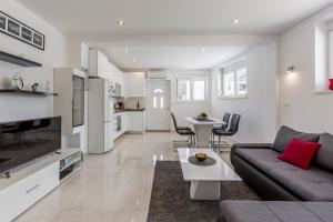Kuchyň nebo kuchyňský kout v ubytování Apartments Amore