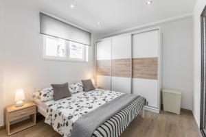 Postel nebo postele na pokoji v ubytování Apartments Amore
