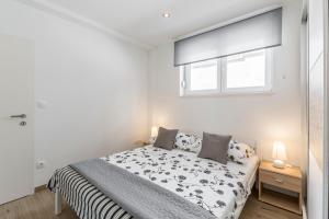 Postel nebo postele na pokoji v ubytování Apartments Amore