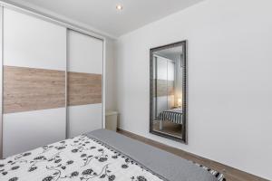 Postel nebo postele na pokoji v ubytování Apartments Amore