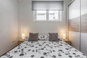Postel nebo postele na pokoji v ubytování Apartments Amore