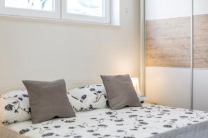 Postel nebo postele na pokoji v ubytování Apartments Amore