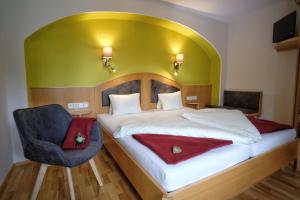Ένα ή περισσότερα κρεβάτια σε δωμάτιο στο SeeHotel & SeeApartments Kärntnerhof- direkt am See!