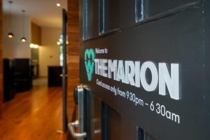 a sign that says the marron on a door at The Marion Hostel in Wellington