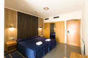 Ένα ή περισσότερα κρεβάτια σε δωμάτιο στο Hotel Brisa da Lanzada +31 φωτογραφίες