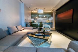 a living room with a couch and a table at Romance Phenthouse at Palms Place in Las Vegas
