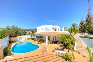 a villa with a swimming pool and stairs at Villas2go2 V5 Vilamoura XXI in Vilamoura