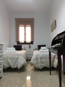 Postel nebo postele na pokoji v ubytování Casa de Corralón