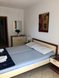 Un ou plusieurs lits dans un hébergement de l'établissement Villa Domora apartments