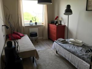 Postel nebo postele na pokoji v ubytování Apartamenty Legionów