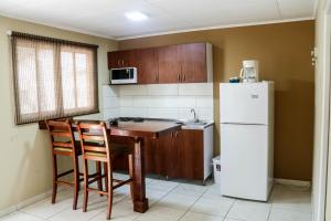 Kuchyň nebo kuchyňský kout v ubytování Coconut Inn