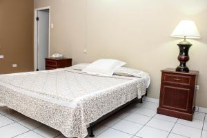 Postel nebo postele na pokoji v ubytování Coconut Inn